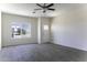 Bright living room with a large window, white door, and stylish tile flooring at 3725 N Bandelier Dr, Eloy, AZ 85131