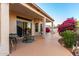 Spacious covered patio featuring a seating area and sliding glass doors at 3781 N 161St Dr, Goodyear, AZ 85395