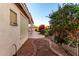 A tranquil backyard with a winding walkway and colorful landscaping at 3781 N 161St Dr, Goodyear, AZ 85395
