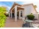 Charming covered patio offering a glimpse of a comfortable seating area within the home at 3781 N 161St Dr, Goodyear, AZ 85395