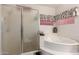 Relaxing bathroom showcasing a soaking tub, adjacent to a glass-enclosed shower area at 3781 N 161St Dr, Goodyear, AZ 85395