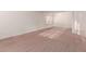 Bedroom with neutral carpet, natural light from the windows, and a chandelier at 3781 N 161St Dr, Goodyear, AZ 85395
