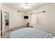 Cozy bedroom features a ceiling fan, a window, and a closet with sliding doors at 3781 N 161St Dr, Goodyear, AZ 85395