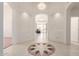 Inviting foyer with decorative tile inlay, archways and a view of the living area beyond at 3781 N 161St Dr, Goodyear, AZ 85395