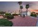 Beautiful home featuring desert landscaping and mature palm trees at 3781 N 161St Dr, Goodyear, AZ 85395