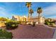 Inviting home featuring desert landscaping, mature trees, and a welcoming entrance at 3781 N 161St Dr, Goodyear, AZ 85395
