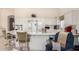 Eat-in kitchen with abundant storage and bar seating is great for entertaining or casual meals at 3781 N 161St Dr, Goodyear, AZ 85395