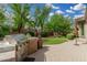 Serene backyard featuring a built-in BBQ, lush lawn and mature landscaping at 3945 E Cherry Hills Dr, Chandler, AZ 85249