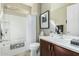 Functional bathroom with a tub-shower combo, modern vanity, and framed mirror enhancing comfort and style at 3945 E Cherry Hills Dr, Chandler, AZ 85249