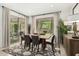 Elegant dining room with a large table, stylish rug, and sliding glass doors leading to the backyard at 3945 E Cherry Hills Dr, Chandler, AZ 85249
