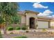 Charming front exterior with a tiled roof, arched entrance, and well-manicured desert landscaping for inviting curb appeal at 3945 E Cherry Hills Dr, Chandler, AZ 85249