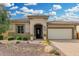 Charming single-story home featuring a beautiful desert landscape, a covered entryway, and a two-car garage at 3945 E Cherry Hills Dr, Chandler, AZ 85249