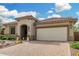Inviting single-story home featuring desert landscaping, brick driveway and a two-car garage at 3945 E Cherry Hills Dr, Chandler, AZ 85249