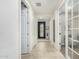 Bright hallway featuring stylish tile floors, an elegant front door and white paneled doors at 3945 E Cherry Hills Dr, Chandler, AZ 85249