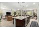 Open-concept kitchen with large island overlooks the living room and dining area, perfect for entertaining at 3945 E Cherry Hills Dr, Chandler, AZ 85249