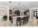 Modern kitchen with stainless steel appliances, a large island with seating, and pendant lighting at 3945 E Cherry Hills Dr, Chandler, AZ 85249