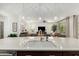 Spacious kitchen island with sink and ample countertop space, with an open view into the living area at 3945 E Cherry Hills Dr, Chandler, AZ 85249