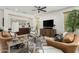 Cozy living room featuring a built-in wet bar, comfortable seating, and a flat-screen TV at 3945 E Cherry Hills Dr, Chandler, AZ 85249