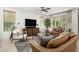 Bright living room featuring a large window with a sliding glass door, and comfortable seating at 3945 E Cherry Hills Dr, Chandler, AZ 85249