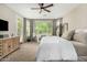 Relaxing main bedroom with a large bay window, dresser, and comfortable seating with ample natural light at 3945 E Cherry Hills Dr, Chandler, AZ 85249