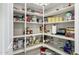 Walk-in pantry with ample shelving provides plenty of storage for food and kitchen essentials at 3945 E Cherry Hills Dr, Chandler, AZ 85249