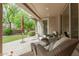 Relaxing covered patio with comfortable seating overlooking a manicured lawn creating a perfect outdoor retreat at 3945 E Cherry Hills Dr, Chandler, AZ 85249