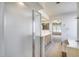 Bathroom features a glass shower, a bright vanity, and access to another bedroom at 4001 E Rosemonte Dr, Phoenix, AZ 85050