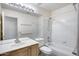 Cozy bathroom featuring a shower-tub combination and neutral-toned vanity with a large mirror at 4001 E Rosemonte Dr, Phoenix, AZ 85050