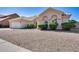 Attractive single-story home featuring a two-car garage and low maintenance gravel landscaping at 4001 E Rosemonte Dr, Phoenix, AZ 85050