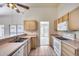 Bright kitchen with light wood cabinets, white appliances, and a tile floor at 4001 E Rosemonte Dr, Phoenix, AZ 85050