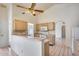 Kitchen featuring light wood cabinets and white appliances with a tile floor at 4001 E Rosemonte Dr, Phoenix, AZ 85050