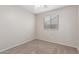 Bedroom featuring plush carpet, a ceiling fan, and natural light at 4094 E Los Altos Dr, Gilbert, AZ 85297