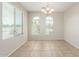Bright dining room featuring tile floors, neutral walls, and arched windows at 4094 E Los Altos Dr, Gilbert, AZ 85297