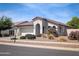 Charming single-story home featuring desert landscaping, a two-car garage, and a covered entry way at 4094 E Los Altos Dr, Gilbert, AZ 85297