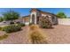 Well-kept single-story home featuring rock landscaping, a two-car garage, and a covered entry way at 4094 E Los Altos Dr, Gilbert, AZ 85297
