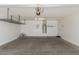 Spacious garage featuring a water heater, storage racks, and ample space at 4094 E Los Altos Dr, Gilbert, AZ 85297