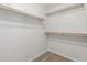 Walk-in closet with wood shelving and carpet flooring at 4094 E Los Altos Dr, Gilbert, AZ 85297