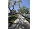 Scenic walking path beside a tranquil lake and manicured green space, perfect for outdoor enjoyment in the community at 4094 E Los Altos Dr, Gilbert, AZ 85297
