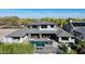 Bird's eye view of a luxury home featuring outdoor living spaces, a pool, and desert landscaping at 4098 N Golf Dr, Buckeye, AZ 85396