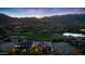 Stunning aerial view captures a luxury home adjacent to a golf course, offering scenic views and exclusive community living at 4098 N Golf Dr, Buckeye, AZ 85396