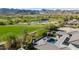 Scenic backyard view of a golf course and water feature framed by distant mountains on a sunny day at 4098 N Golf Dr, Buckeye, AZ 85396
