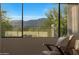 Bedroom mountain view through a set of large windows at 4098 N Golf Dr, Buckeye, AZ 85396