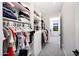 A walk-in closet has built-in shelves and drawers to maximize storage capacity at 4098 N Golf Dr, Buckeye, AZ 85396
