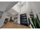 Contemporary home foyer with soaring ceilings, modern lighting, and sleek front door at 4098 N Golf Dr, Buckeye, AZ 85396