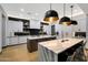 Modern kitchen with two islands, sleek cabinets, and stylish pendant lighting at 4098 N Golf Dr, Buckeye, AZ 85396
