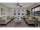 Bright living room featuring neutral tones, stylish furniture, and a view of the outdoors at 4098 N Golf Dr, Buckeye, AZ 85396