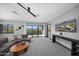 Bright living room with large windows showcasing mountain views and modern decor at 4098 N Golf Dr, Buckeye, AZ 85396