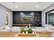 Modern living room with stylish decor, decorative wall, and comfortable lounging space at 4098 N Golf Dr, Buckeye, AZ 85396