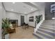 Office space with modern desk and decor, hardwood floors, and staircase at 4098 N Golf Dr, Buckeye, AZ 85396