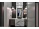 Modern powder room with unique vanity, stylish fixtures, and decorative elements at 4098 N Golf Dr, Buckeye, AZ 85396